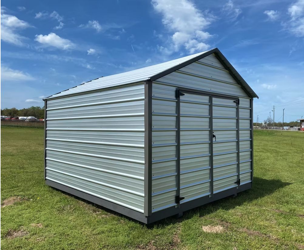 All-metal economy shed with white horizontal siding, charcoal trim and double doors on the gable end